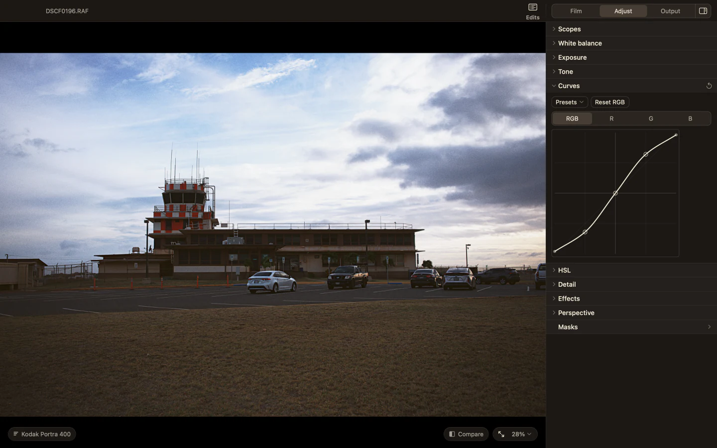 Milkglass showing an airfield control tower at dusk with the Curves section open in the Adjust page.